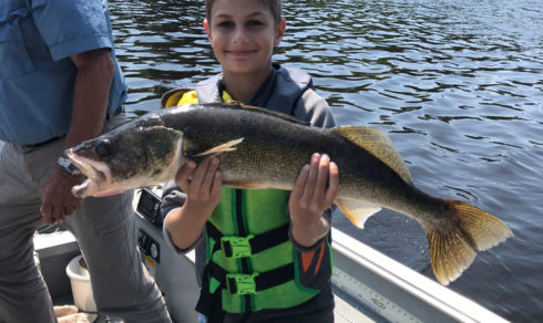 A boy and his trophy walleye.