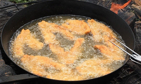 Walleye frying on the fire.