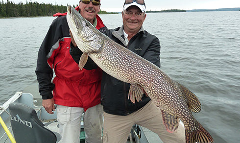 Two men with a trophy northern pike.