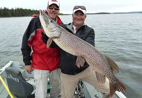 Two men with a trophy northern pike.