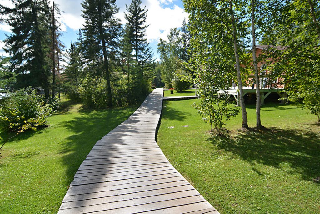 Boardwalk between cabins at the Kettle Falls fishing resort