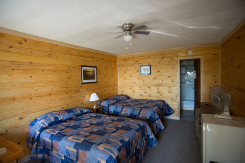 Double beds inside one of our cabins at Kettle Falls Lodge