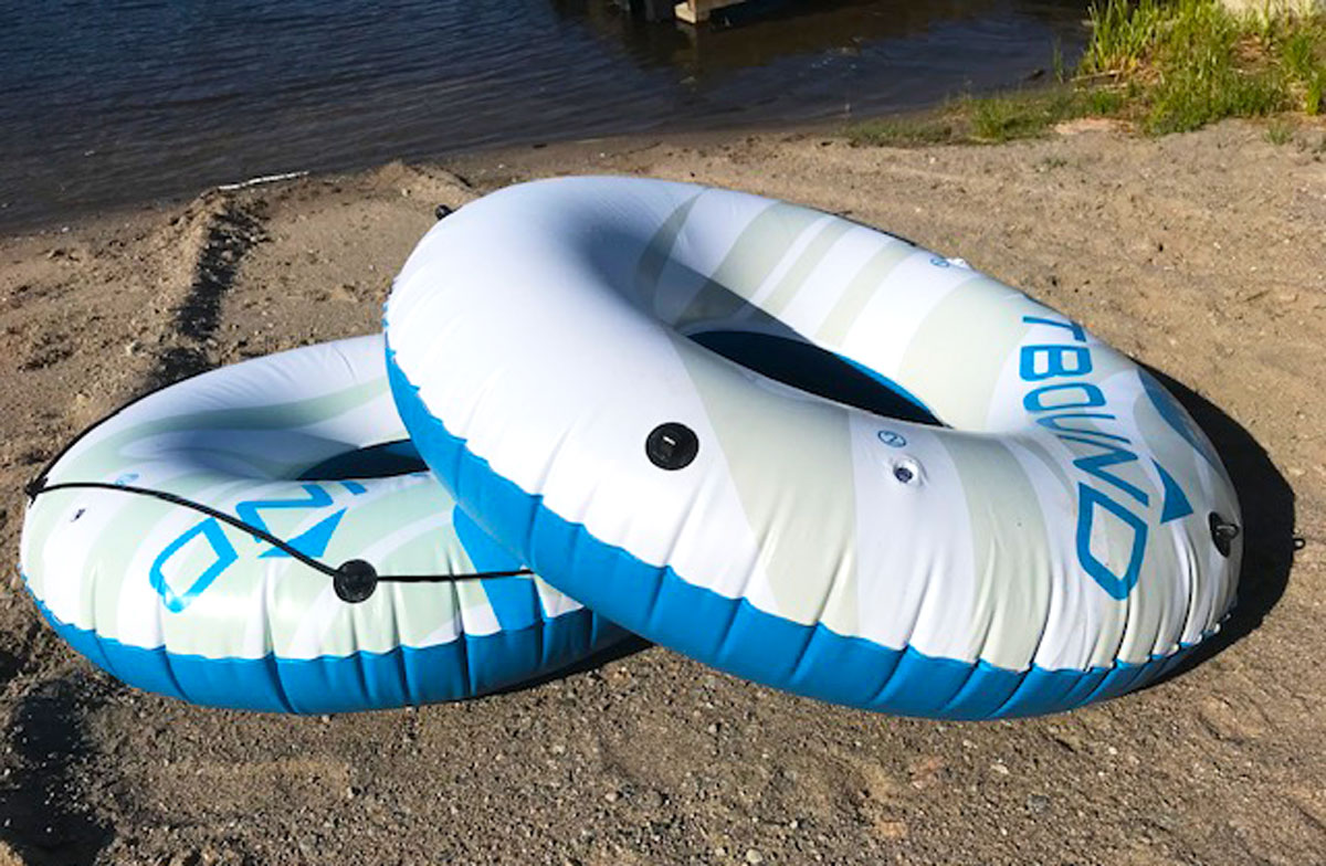 A pair of flotation tubes on a beach