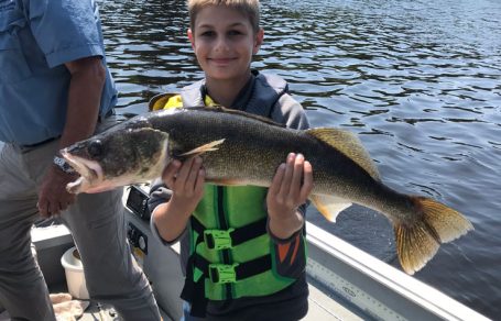 A boy and his trophy walleye.